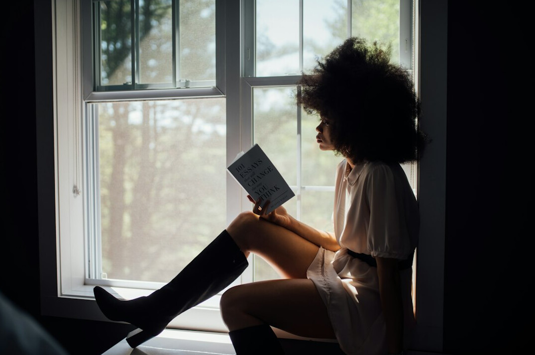 person reading mystery novel