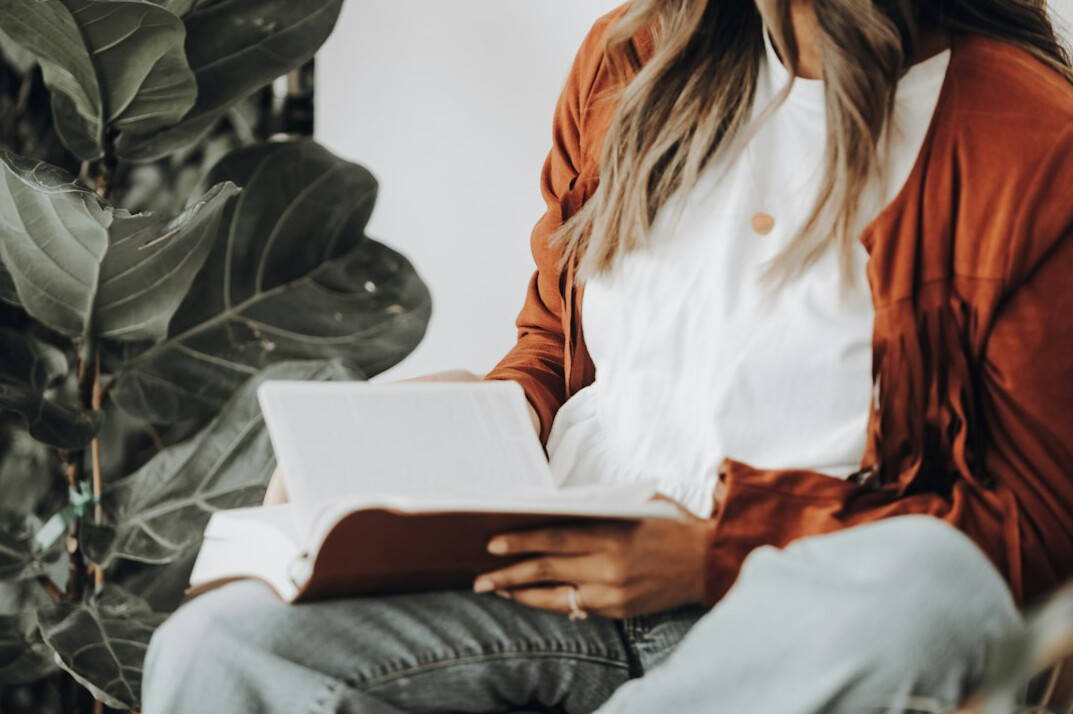 woman reading mystery book