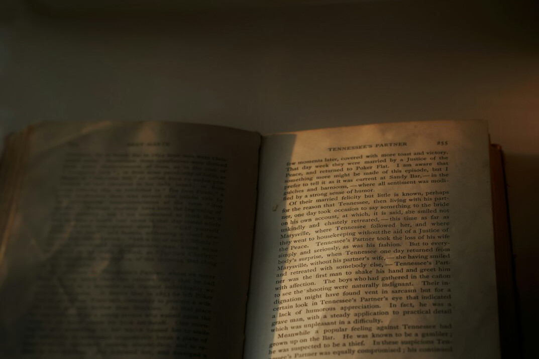Open book with pages lit by warm light